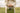 Woman holding AINMHÍ Ireland green patterned tote bag in grassy field, natural skincare brand